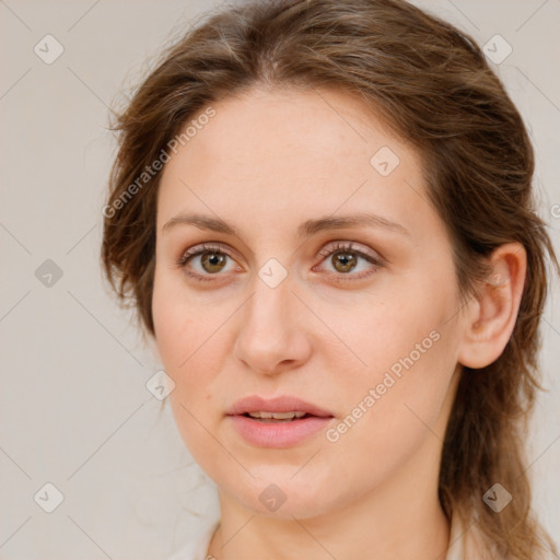 Joyful white young-adult female with medium  brown hair and green eyes