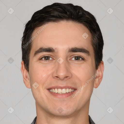 Joyful white young-adult male with short  black hair and brown eyes