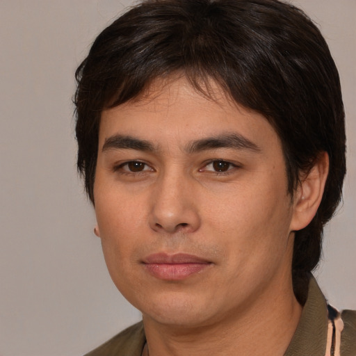 Joyful white young-adult male with medium  brown hair and brown eyes