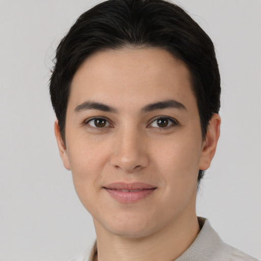 Joyful asian young-adult female with short  brown hair and brown eyes