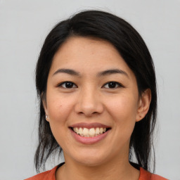 Joyful asian young-adult female with medium  black hair and brown eyes