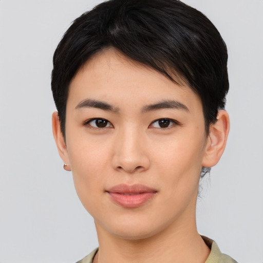 Joyful asian young-adult female with medium  black hair and brown eyes