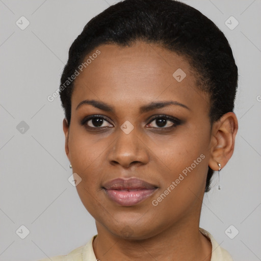 Joyful black young-adult female with short  black hair and brown eyes