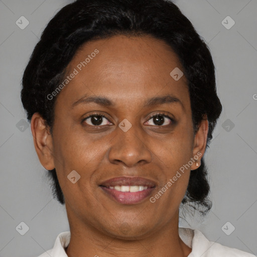 Joyful black adult female with short  brown hair and brown eyes