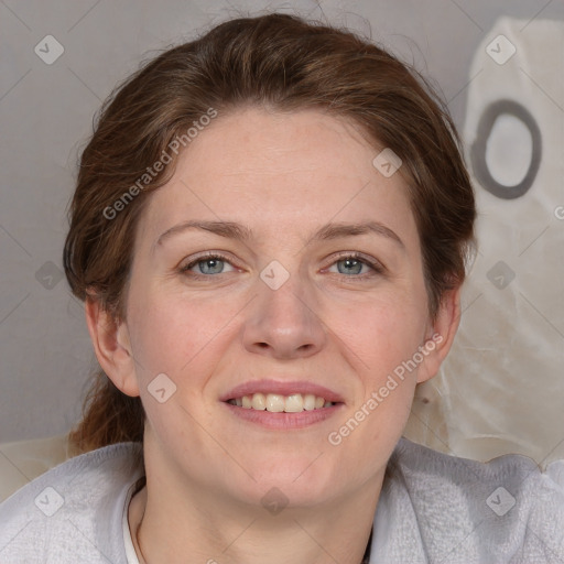 Joyful white adult female with medium  brown hair and blue eyes