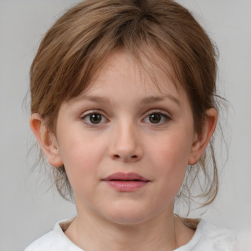 Joyful white child female with medium  brown hair and brown eyes