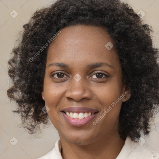 Joyful black young-adult female with medium  brown hair and brown eyes