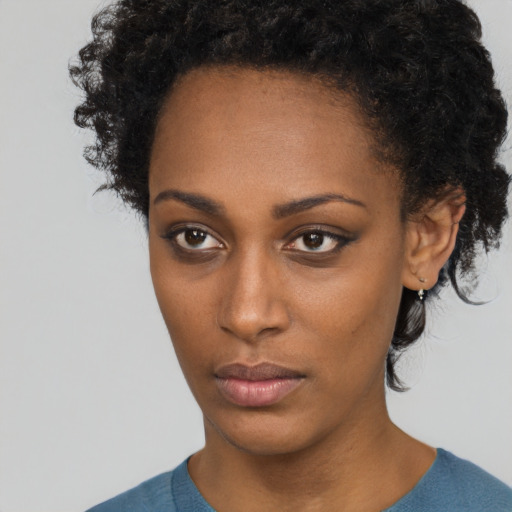 Neutral black young-adult female with short  brown hair and brown eyes
