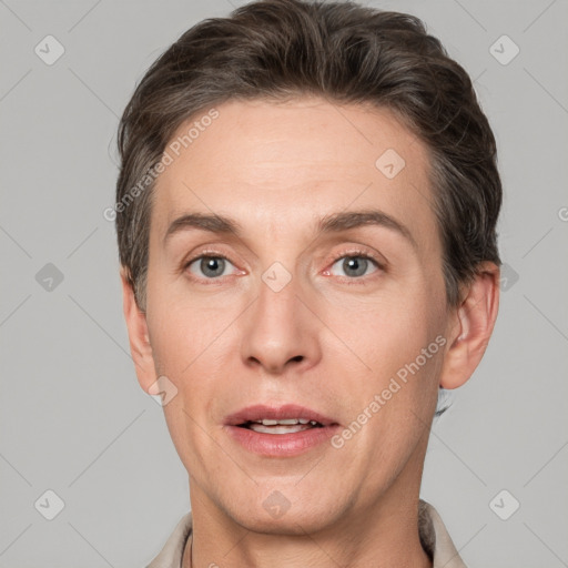 Joyful white adult male with short  brown hair and grey eyes