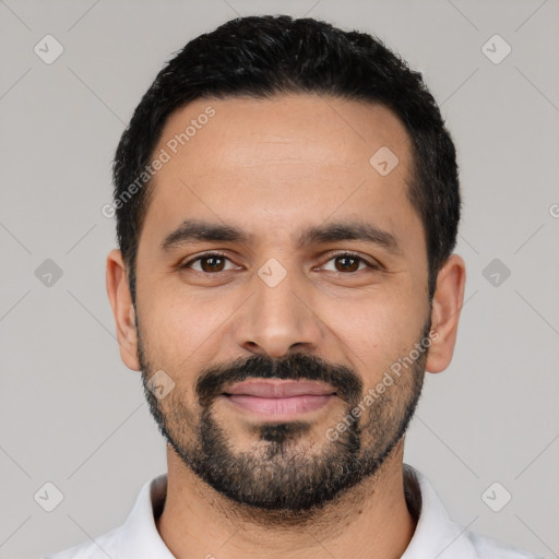 Joyful latino young-adult male with short  black hair and brown eyes