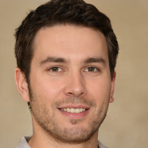 Joyful white young-adult male with short  brown hair and brown eyes