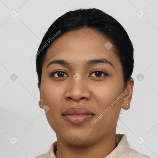 Joyful latino young-adult female with short  black hair and brown eyes