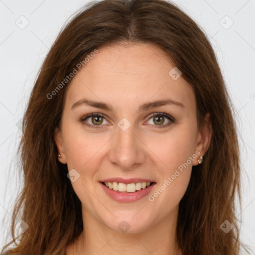 Joyful white young-adult female with long  brown hair and green eyes