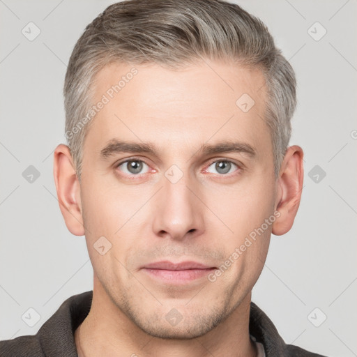 Neutral white young-adult male with short  brown hair and grey eyes