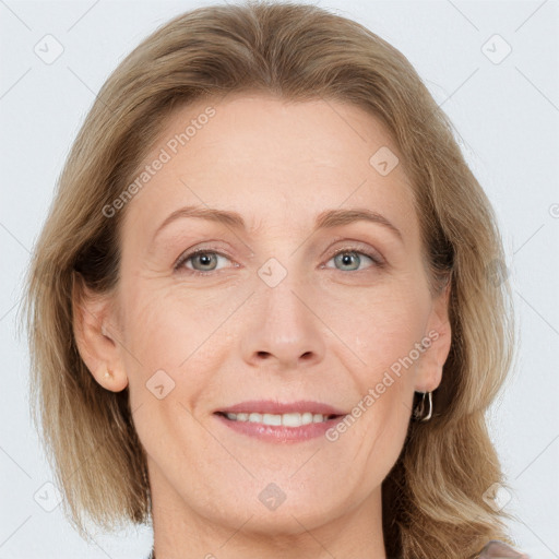 Joyful white adult female with medium  brown hair and grey eyes