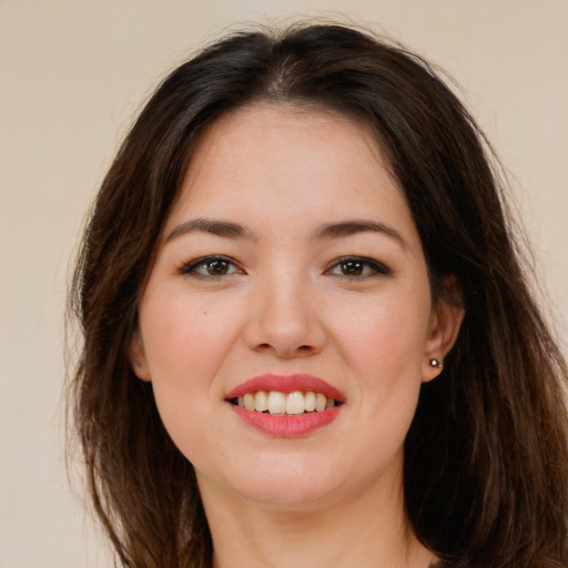 Joyful white young-adult female with long  brown hair and brown eyes