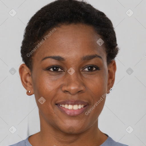 Joyful black young-adult female with short  brown hair and brown eyes