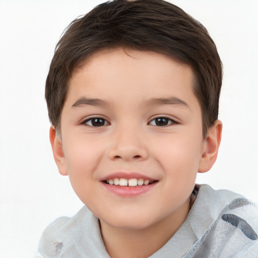 Joyful white child male with short  brown hair and brown eyes