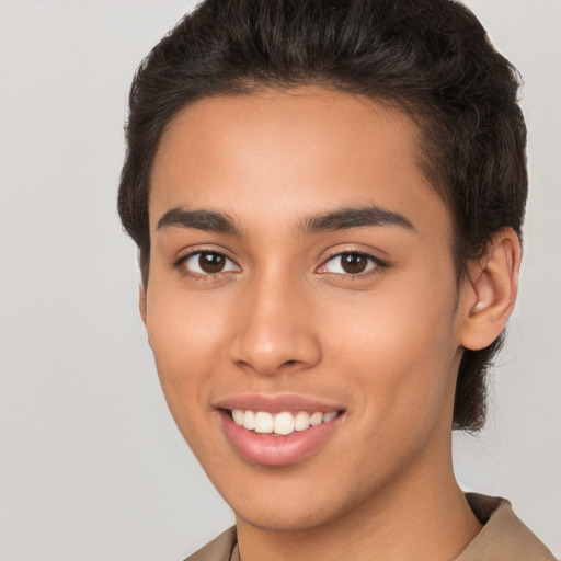 Joyful latino young-adult female with short  brown hair and brown eyes