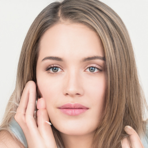 Neutral white young-adult female with long  brown hair and brown eyes