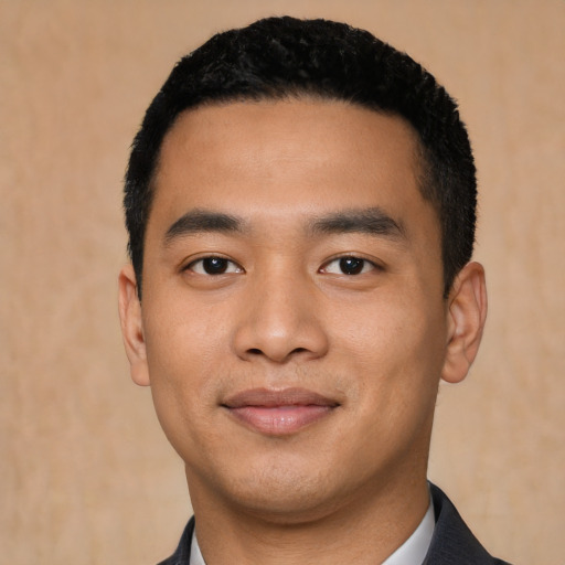 Joyful asian young-adult male with short  black hair and brown eyes