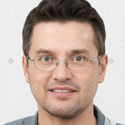 Joyful white adult male with short  brown hair and grey eyes