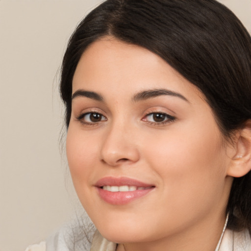 Joyful white young-adult female with medium  brown hair and brown eyes