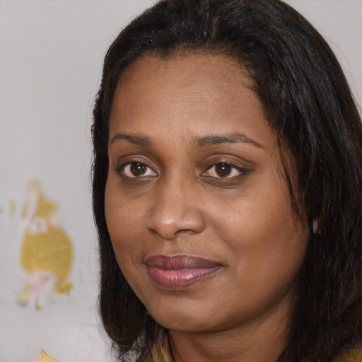 Joyful black young-adult female with medium  brown hair and brown eyes