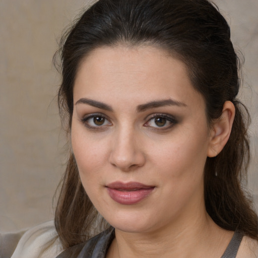 Joyful white young-adult female with medium  brown hair and brown eyes