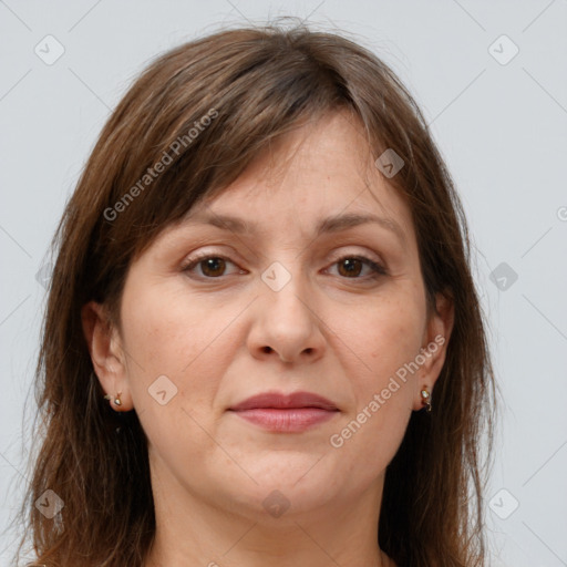 Joyful white adult female with long  brown hair and brown eyes