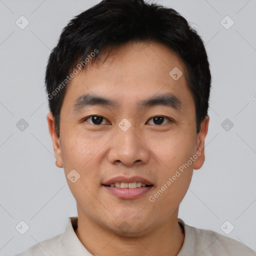 Joyful asian young-adult male with short  brown hair and brown eyes