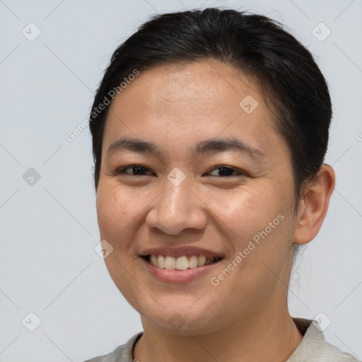 Joyful white young-adult female with short  brown hair and brown eyes