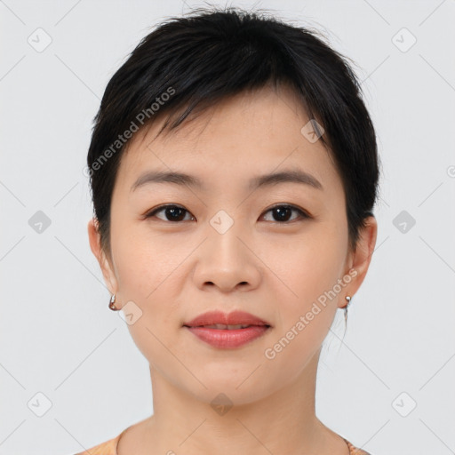 Joyful asian young-adult female with short  black hair and brown eyes