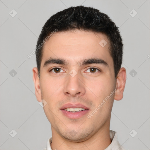 Joyful white young-adult male with short  brown hair and brown eyes