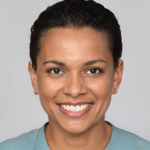 Joyful white young-adult female with short  brown hair and brown eyes