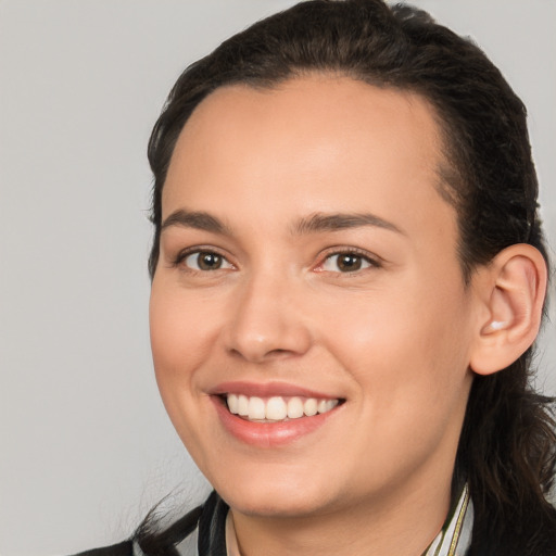 Joyful white young-adult female with medium  brown hair and brown eyes