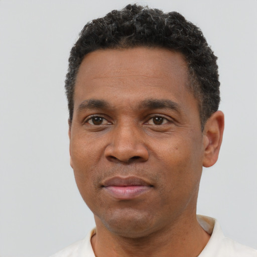 Neutral black adult male with short  black hair and brown eyes