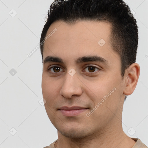 Joyful white young-adult male with short  black hair and brown eyes