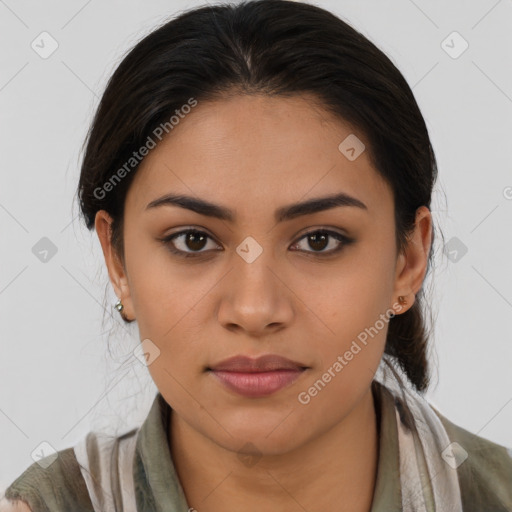 Joyful latino young-adult female with medium  brown hair and brown eyes