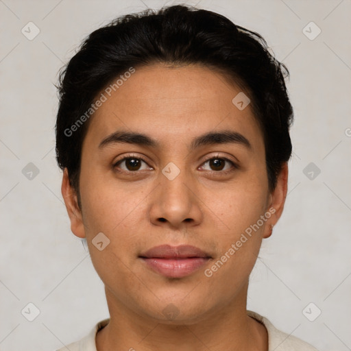 Joyful latino young-adult male with short  brown hair and brown eyes