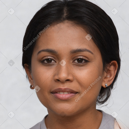 Joyful latino young-adult female with medium  black hair and brown eyes