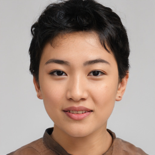 Joyful asian young-adult female with short  black hair and brown eyes