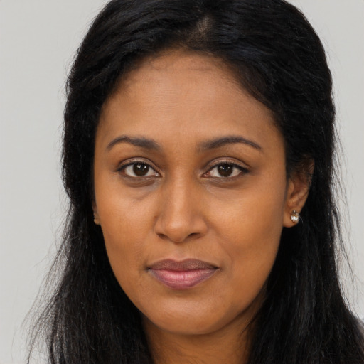 Joyful asian young-adult female with long  brown hair and brown eyes