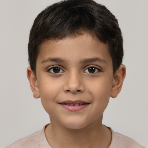 Joyful white child male with short  brown hair and brown eyes