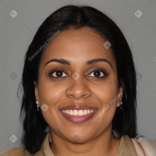 Joyful black young-adult female with long  black hair and brown eyes