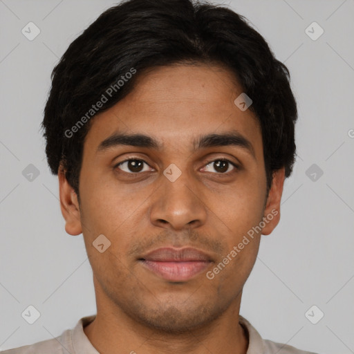 Joyful latino young-adult male with short  black hair and brown eyes