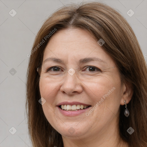 Joyful white adult female with long  brown hair and brown eyes