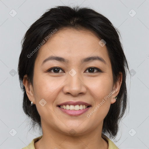 Joyful asian young-adult female with medium  brown hair and brown eyes