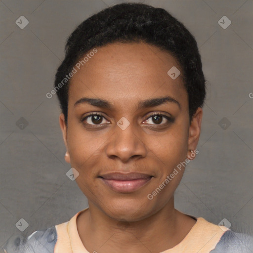 Joyful black young-adult female with short  black hair and brown eyes