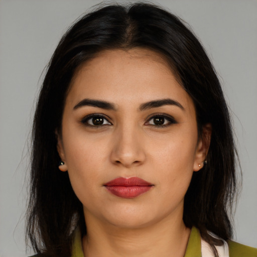 Neutral latino young-adult female with long  brown hair and brown eyes